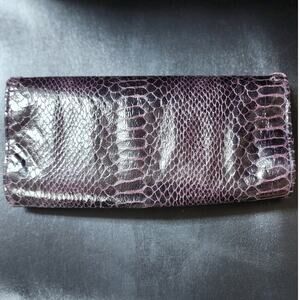 Brand New Bioelements clutch wallet Imitation Snake skin measures 8x4 in size